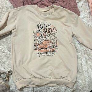 Zach Bryan (something in the orange)